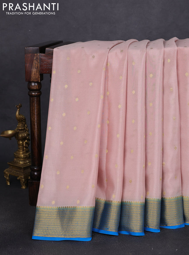 Pure mysore silk saree pastel peach and cs blue with allover zari woven buttas and zari woven border