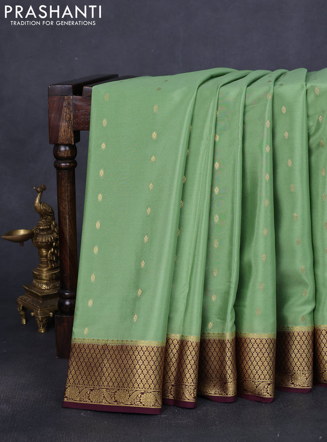 Pure mysore silk saree pista green and coffee brown with allover zari woven buttas and zari woven border