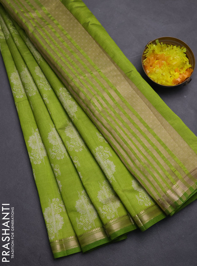 Semi raw silk saree fluorescent green with butta prints and zari woven border