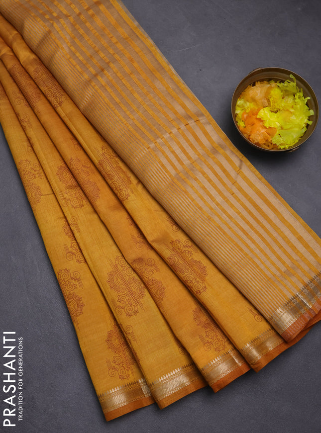 Semi raw silk saree mustard yellow with butta prints and zari woven border