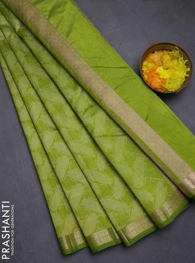 Semi raw silk saree light green with allover geometric prints and zari woven border