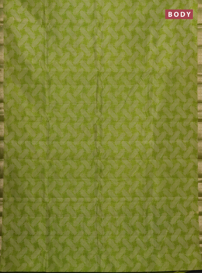 Semi raw silk saree light green with allover geometric prints and zari woven border