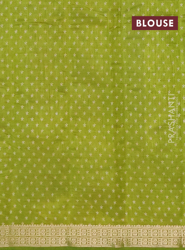 Semi raw silk saree light green with allover geometric prints and zari woven border