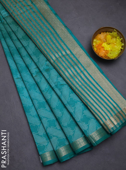 Semi raw silk saree teal blue with allover geometric prints and zari woven border