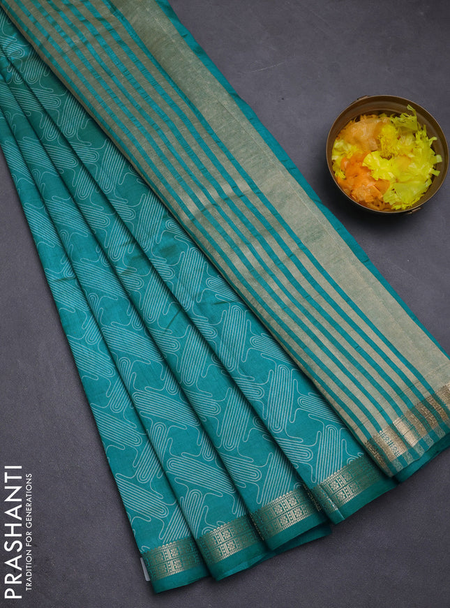 Semi raw silk saree teal blue with allover geometric prints and zari woven border