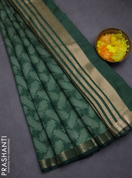 Semi raw silk saree green with allover geometric prints and zari woven border