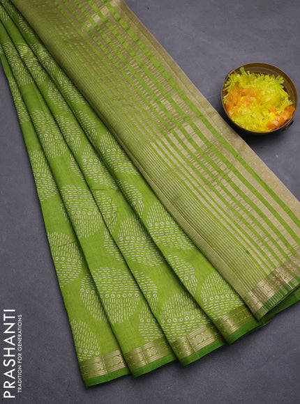 Semi raw silk saree light green with allover geometric butta prints and zari woven border