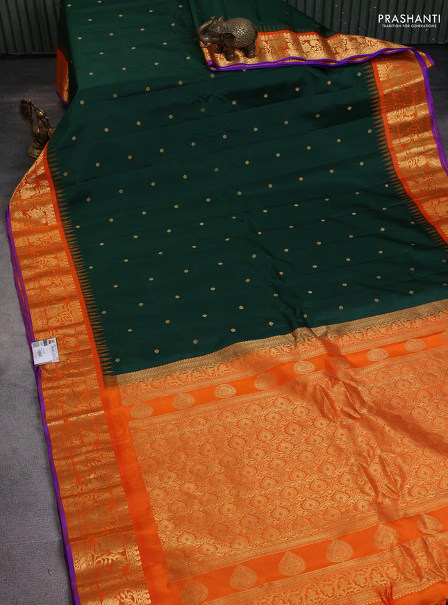 Pure gadwal silk saree bottle green and orange with zari woven buttas and temple design zari woven border