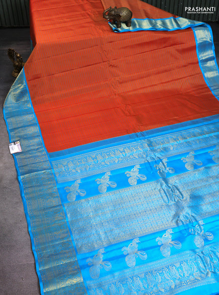 Pure gadwal silk saree rustic orange and blue with allover stripe pattern and rich zari woven border