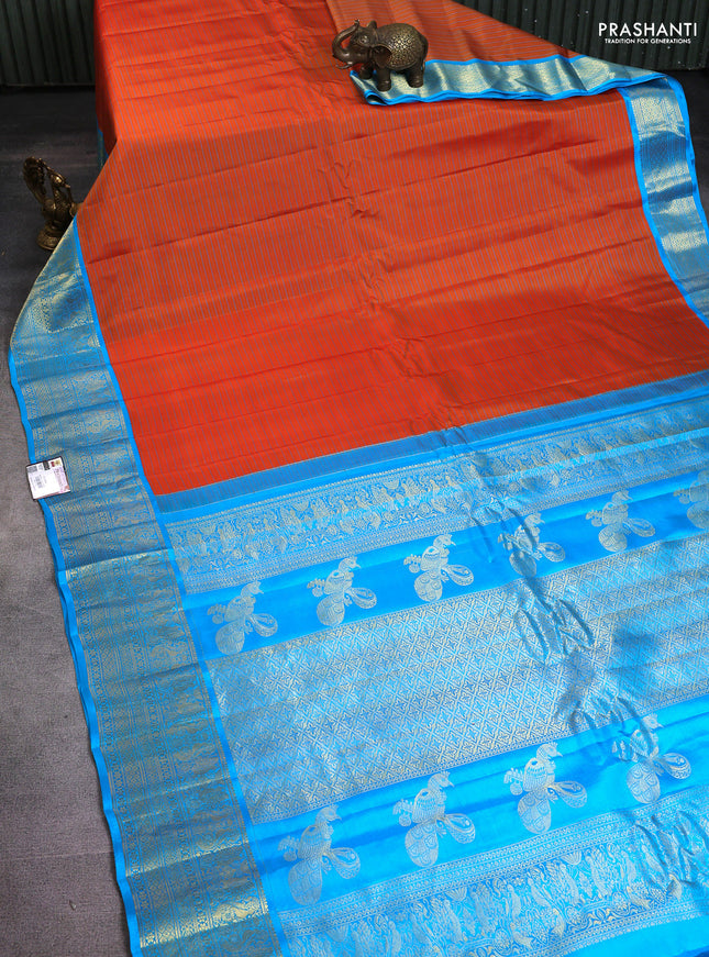 Pure gadwal silk saree rustic orange and blue with allover stripe pattern and rich zari woven border