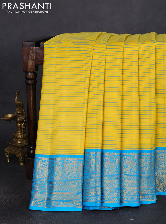 Pure gadwal silk saree yellow and light blue with allover stripe pattern and rich zari woven border