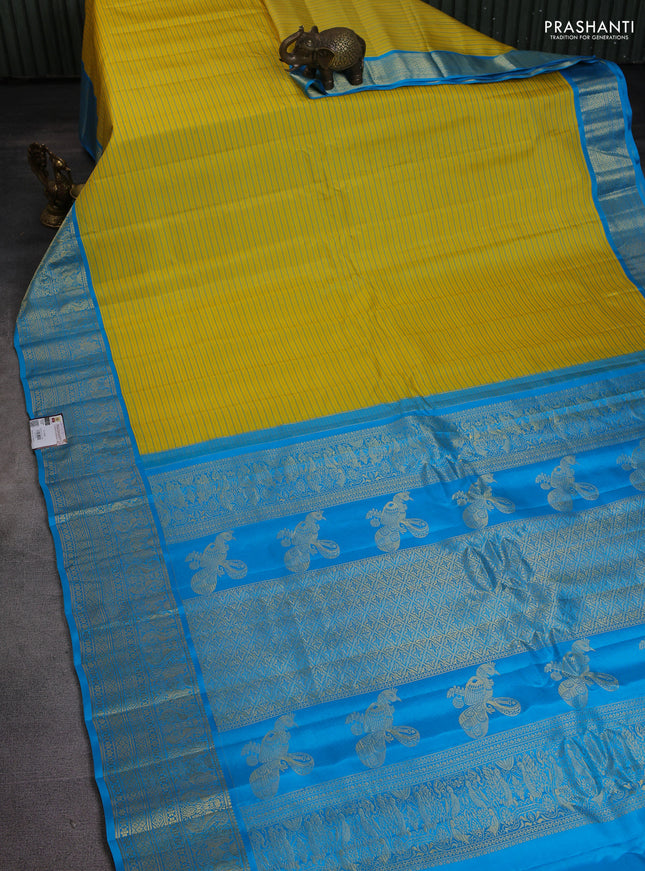 Pure gadwal silk saree yellow and light blue with allover stripe pattern and rich zari woven border