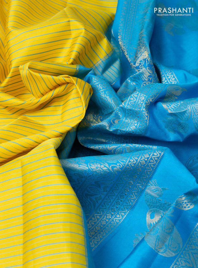 Pure gadwal silk saree yellow and light blue with allover stripe pattern and rich zari woven border