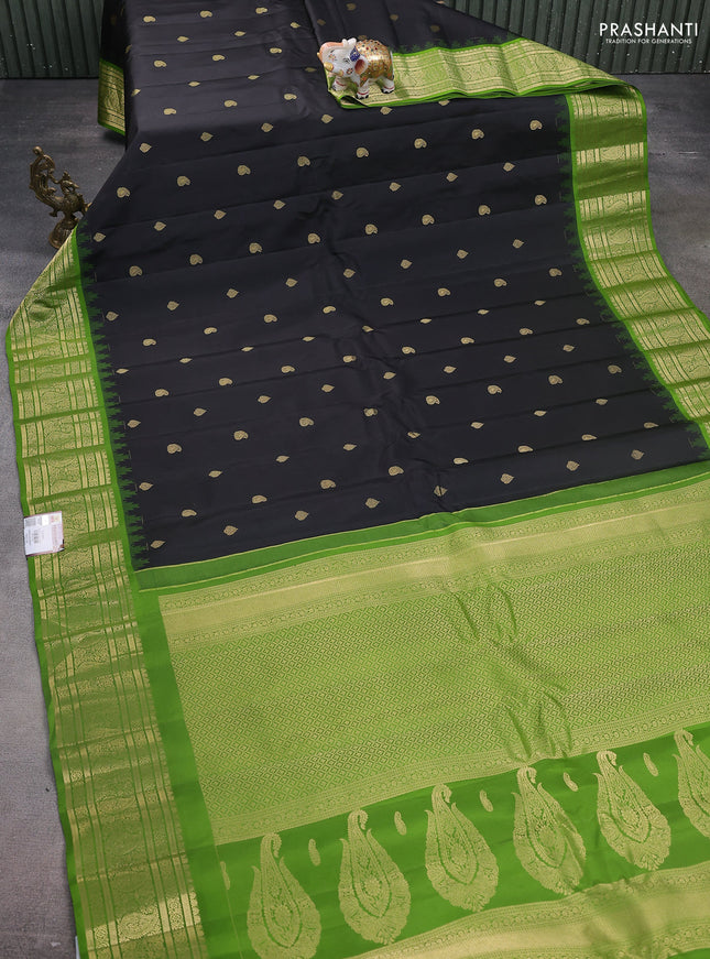 Pure gadwal silk saree black and mehendi green with zari woven buttas and temple design paisley zari woven border