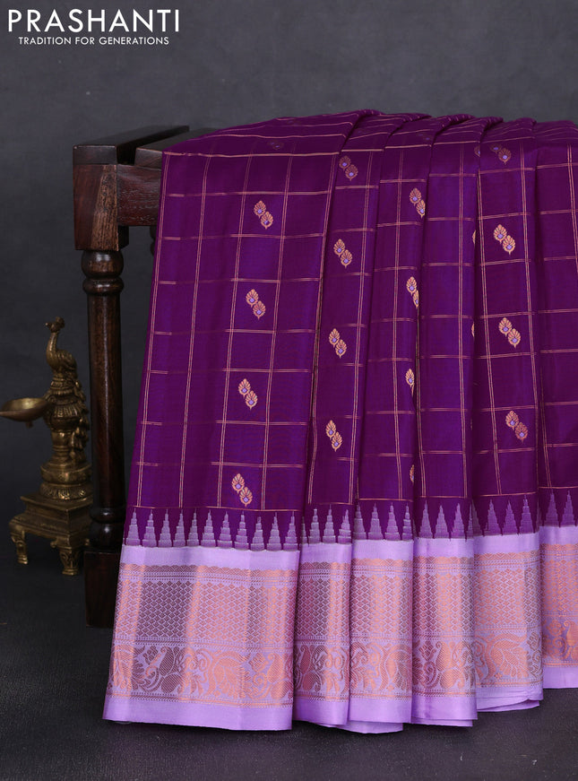 Pure gadwal silk saree purple and lavender with allover zari checks & buttas and temple design zari woven border