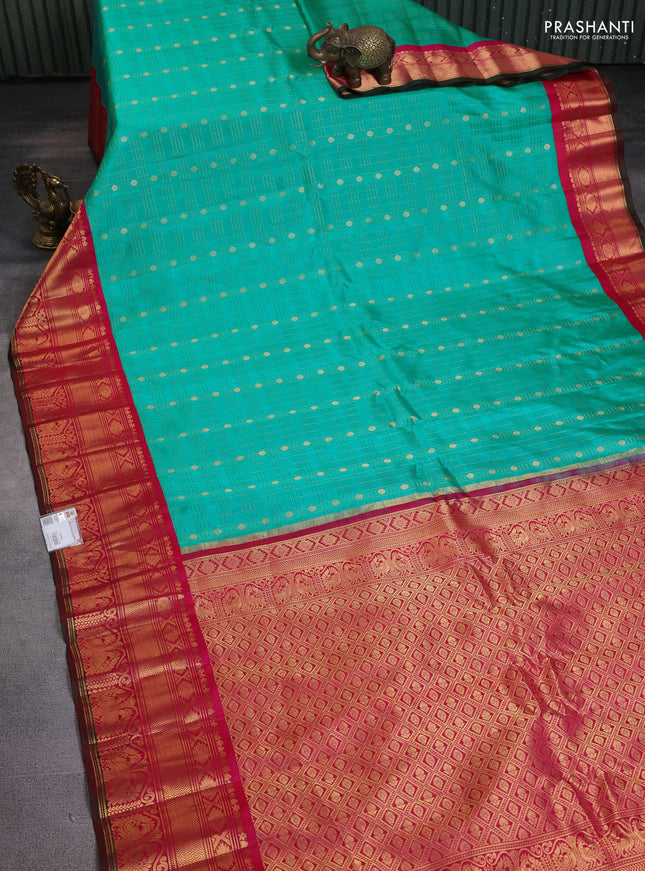 Pure gadwal silk saree teal blue and pink with allover zari checks & buttas and long zari woven border