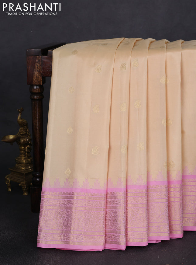 Pure gadwal silk saree cream and light pink with zari woven buttas and temple design paisley zari woven border