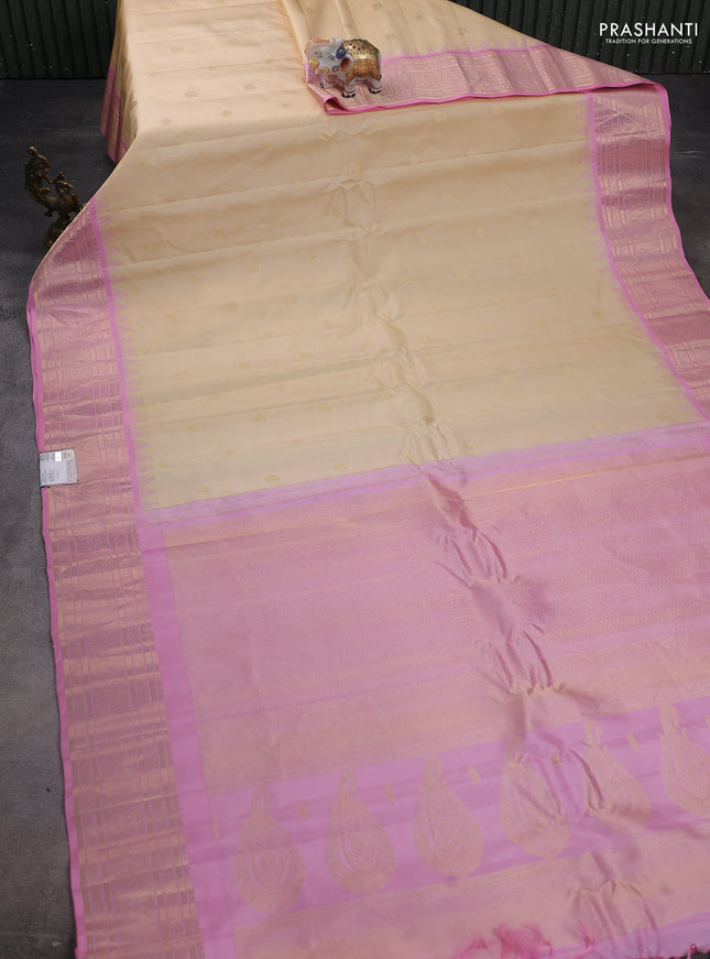 Pure gadwal silk saree cream and light pink with zari woven buttas and temple design paisley zari woven border
