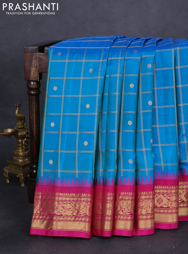 Pure gadwal silk saree dual shade of blue and pink with allover zari checks & buttas and long temple design zari woven border