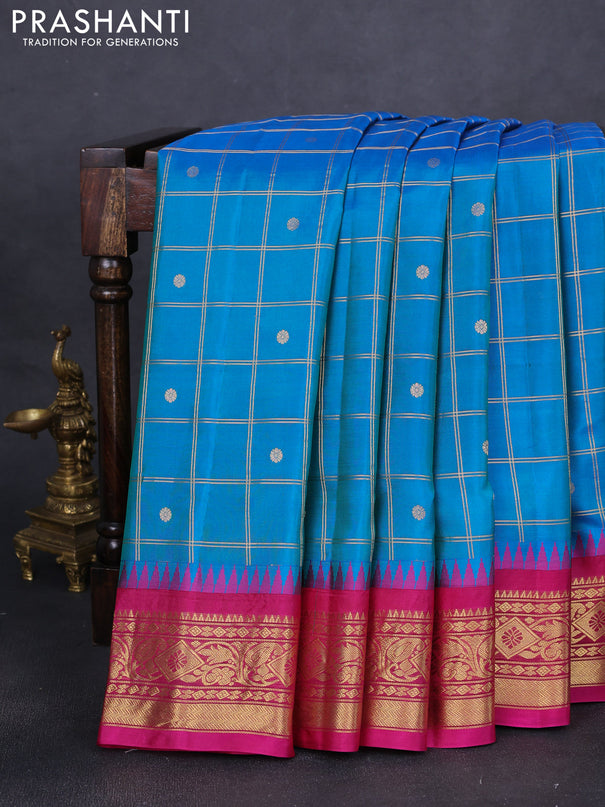 Pure gadwal silk saree dual shade of blue and pink with allover zari checks & buttas and long temple design zari woven border