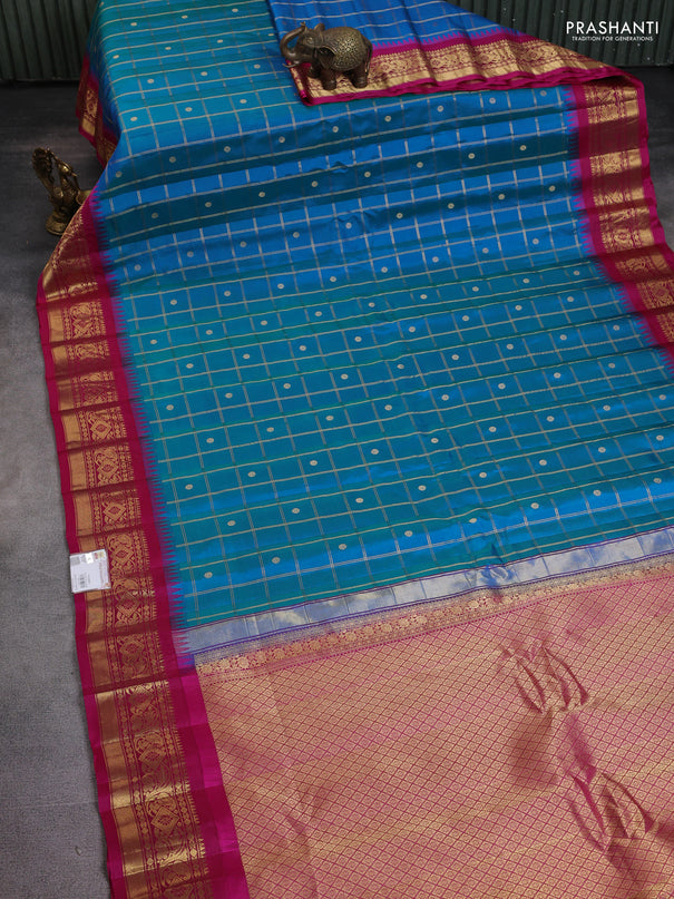Pure gadwal silk saree dual shade of blue and pink with allover zari checks & buttas and long temple design zari woven border