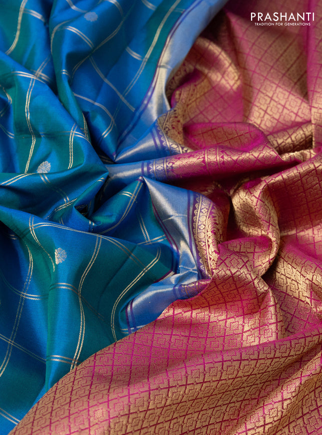 Pure gadwal silk saree dual shade of blue and pink with allover zari checks & buttas and long temple design zari woven border