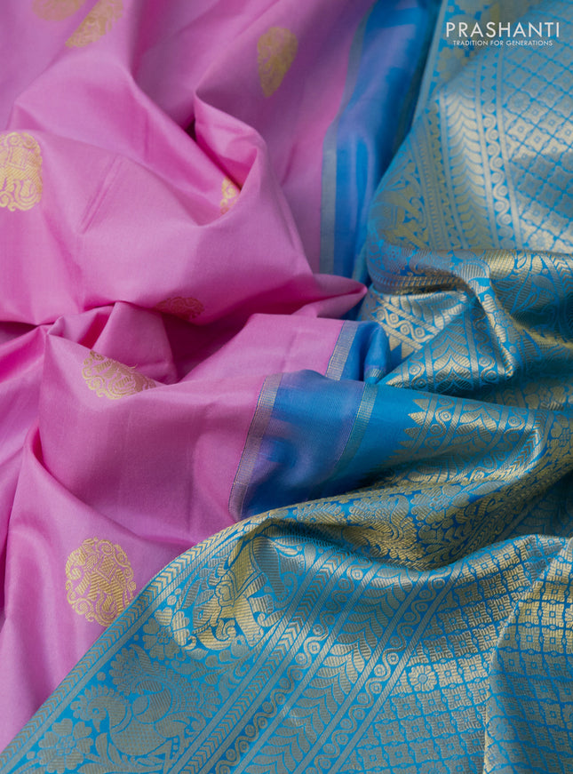 Pure gadwal silk saree lotus pink and cs blue with zari woven buttas and long temple design zari woven border