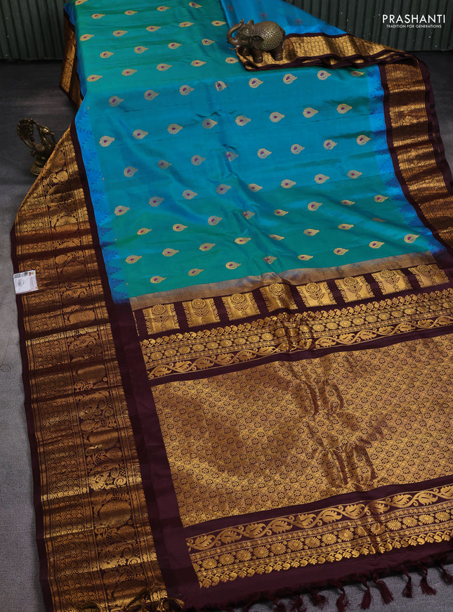 Pure gadwal silk saree cs blue and deep maroon with zari woven buttas and long temple design zari woven border