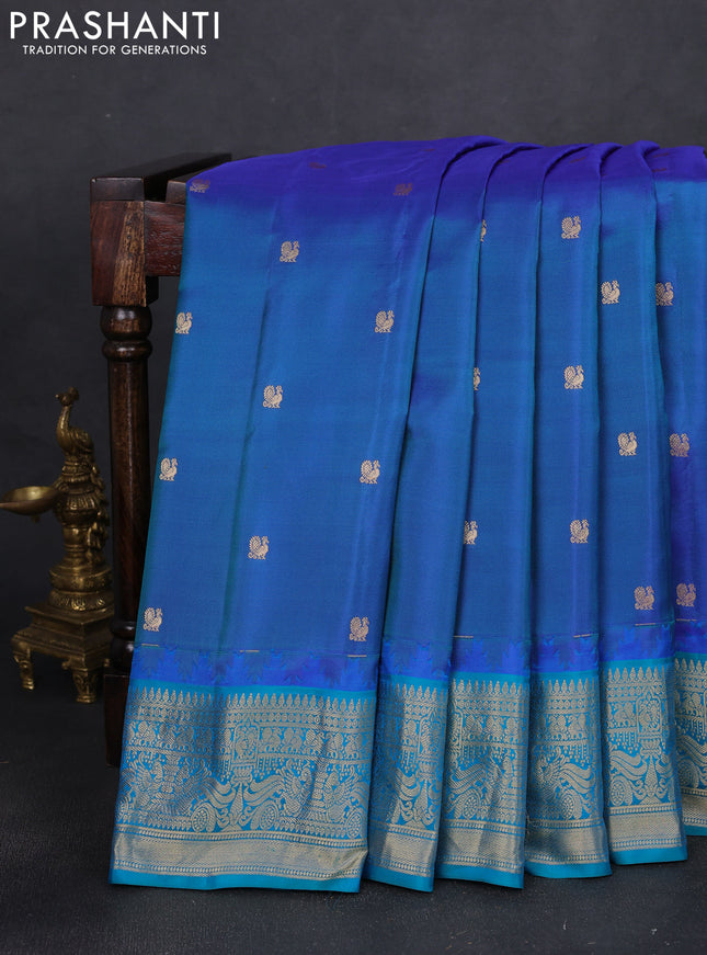 Pure gadwal silk saree dual shade of blue and teal blue with annam zari woven buttas and temple design zari woven border