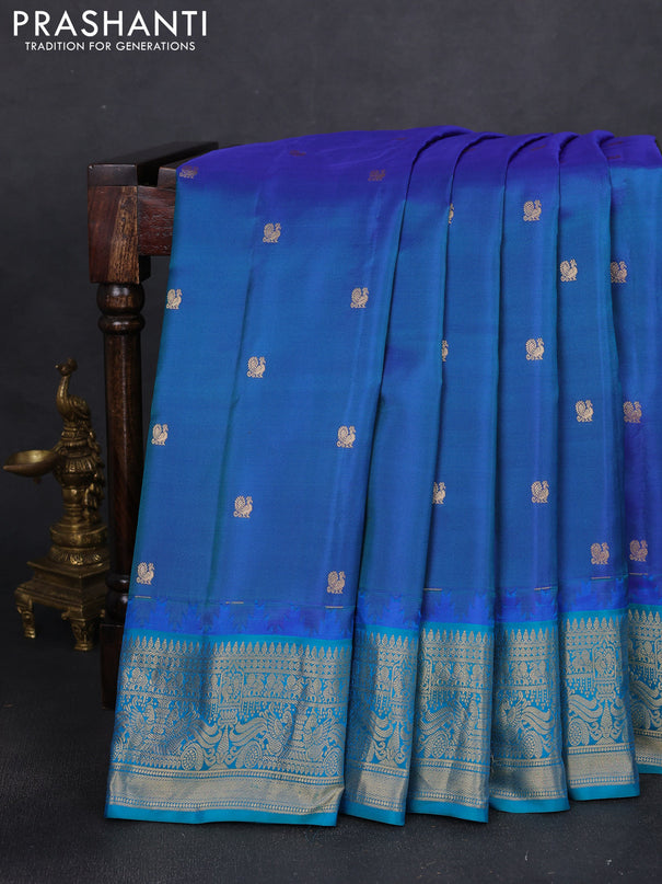 Pure gadwal silk saree dual shade of blue and teal blue with annam zari woven buttas and temple design zari woven border