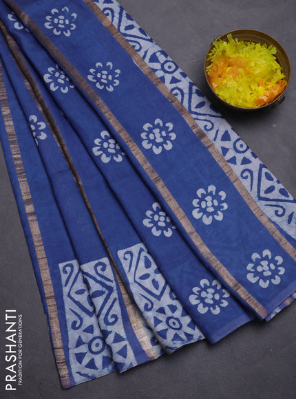 Semi chanderi saree blue with allover zari strips & batik butta prints in borderless style