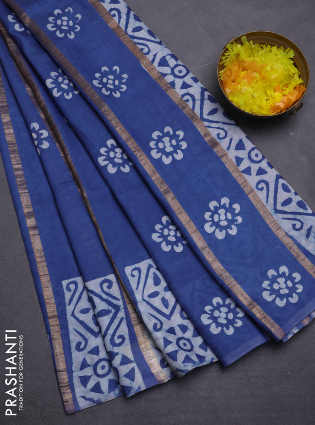 Semi chanderi saree blue with allover zari strips & batik butta prints in borderless style
