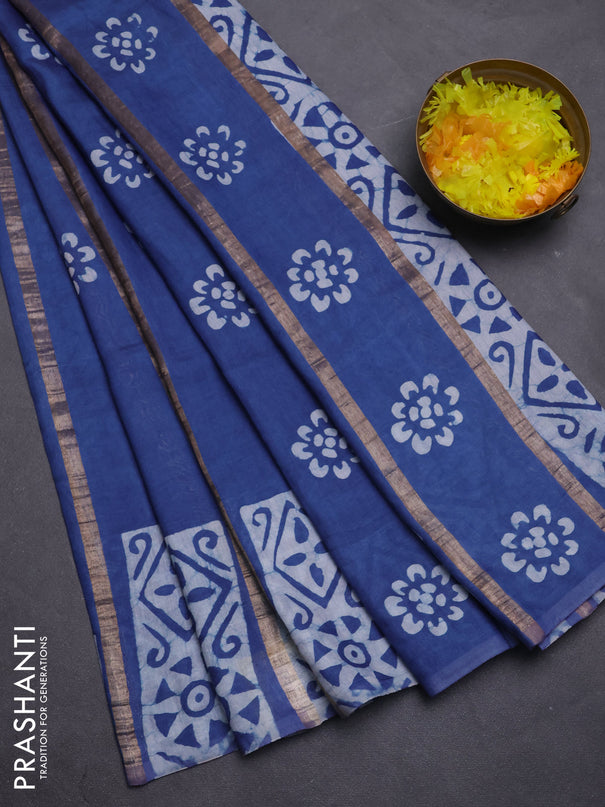 Semi chanderi saree blue with allover zari strips & batik butta prints in borderless style