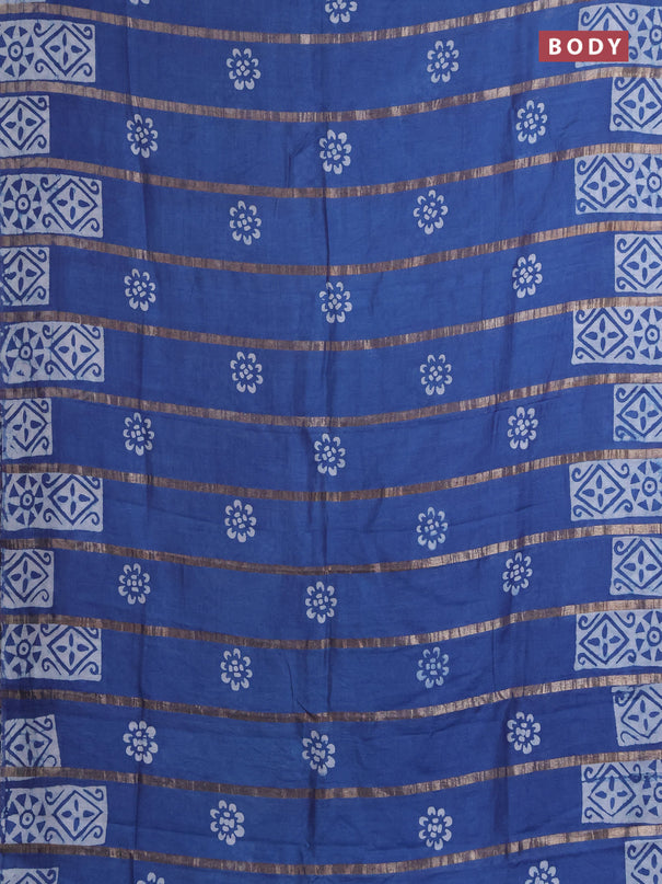 Semi chanderi saree blue with allover zari strips & batik butta prints in borderless style