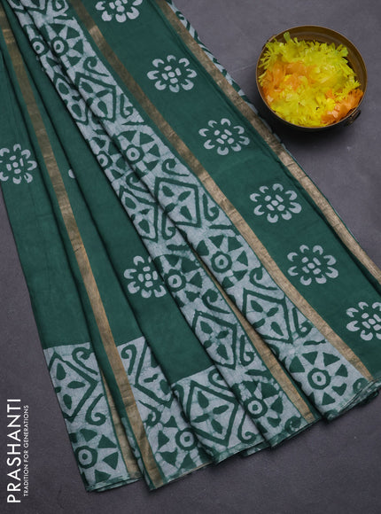 Semi chanderi saree green with allover zari strips & batik butta prints in borderless style