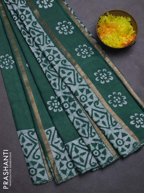 Semi chanderi saree green with allover zari strips & batik butta prints in borderless style