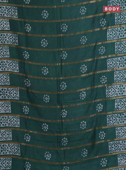 Semi chanderi saree green with allover zari strips & batik butta prints in borderless style
