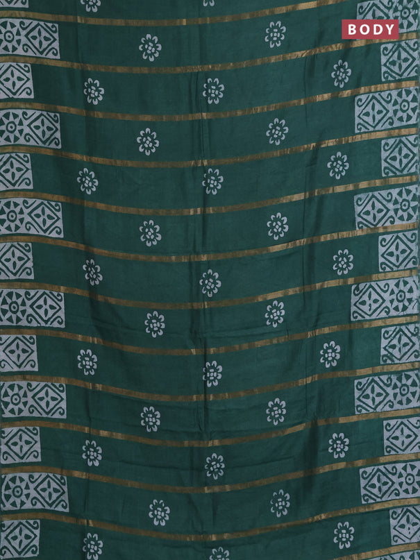 Semi chanderi saree green with allover zari strips & batik butta prints in borderless style