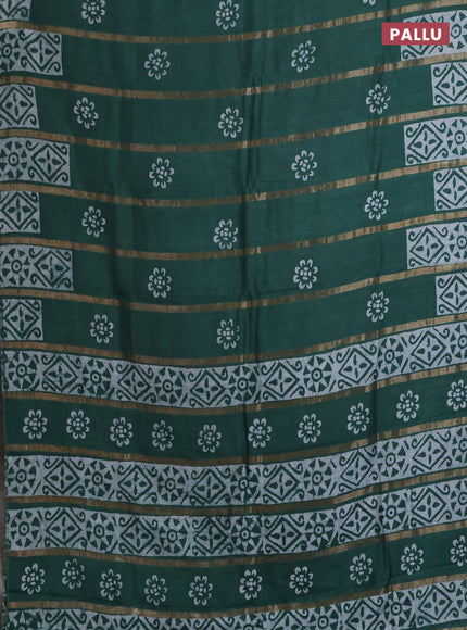 Semi chanderi saree green with allover zari strips & batik butta prints in borderless style