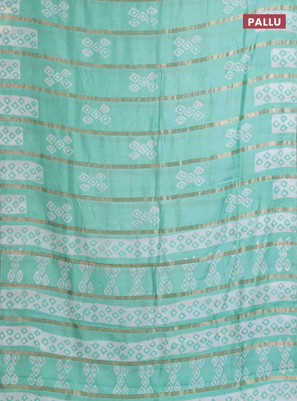 Semi chanderi saree teal green with allover zari strips & batik butta prints in borderless style