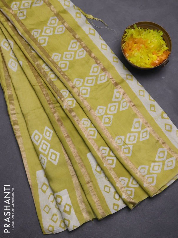 Semi chanderi saree pista green with allover zari strips & batik butta prints in borderless style