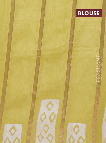 Semi chanderi saree pista green with allover zari strips & batik butta prints in borderless style