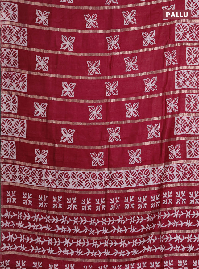 Semi chanderi saree maroon with allover zari strips & batik butta prints in borderless style