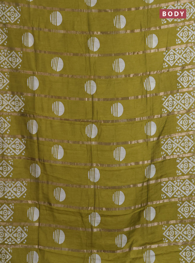 Semi chanderi saree mehendi green with allover zari strips & batik butta prints in borderless style