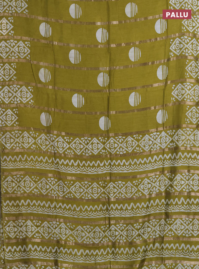 Semi chanderi saree mehendi green with allover zari strips & batik butta prints in borderless style