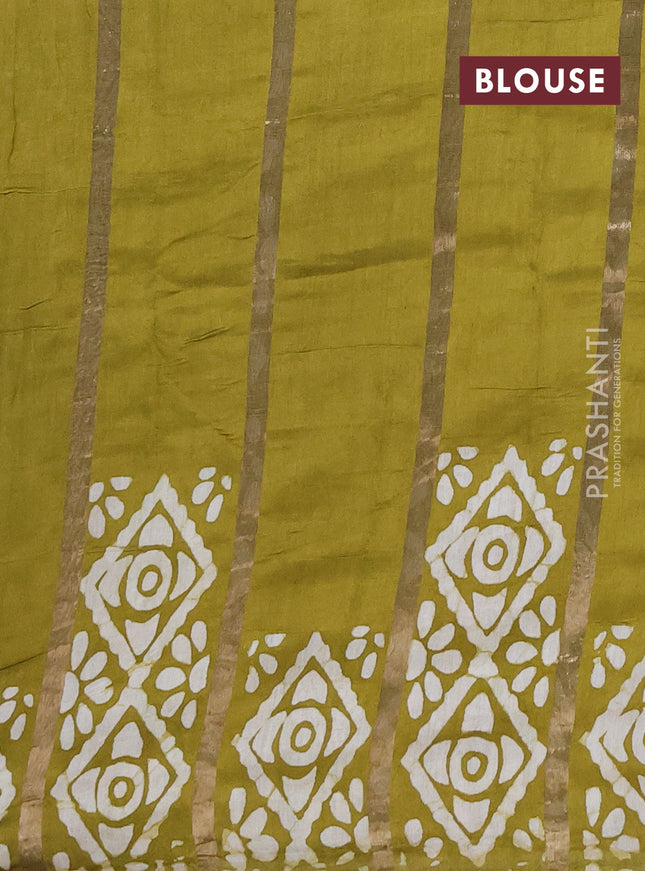 Semi chanderi saree mehendi green with allover zari strips & batik butta prints in borderless style
