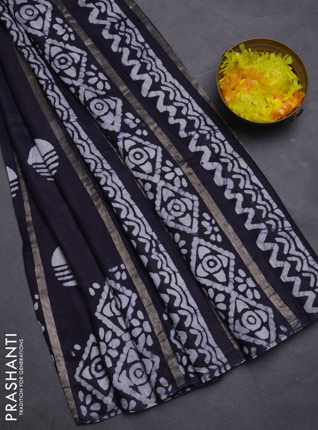 Semi chanderi saree deep navy blue with allover zari strips & batik butta prints in borderless style