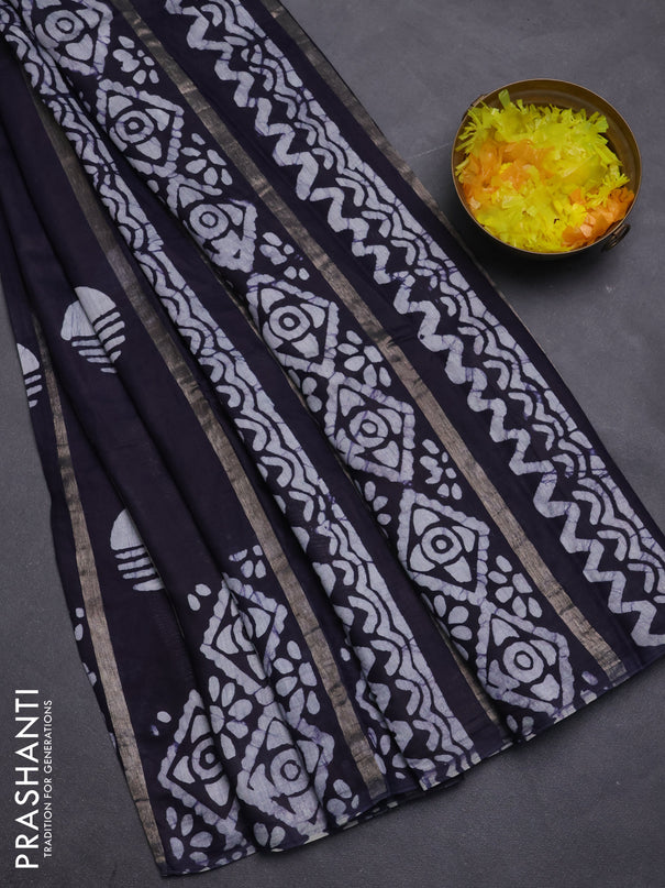 Semi chanderi saree deep navy blue with allover zari strips & batik butta prints in borderless style