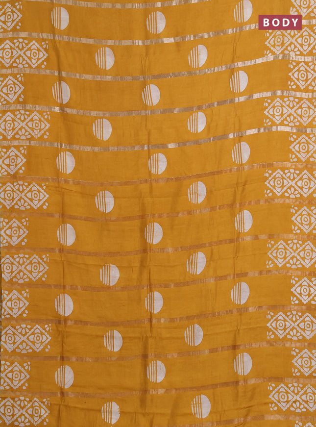 Semi chanderi saree mustard yellow with allover zari strips & batik butta prints in borderless style
