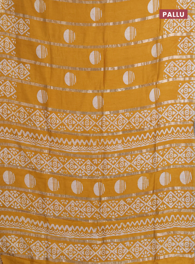 Semi chanderi saree mustard yellow with allover zari strips & batik butta prints in borderless style